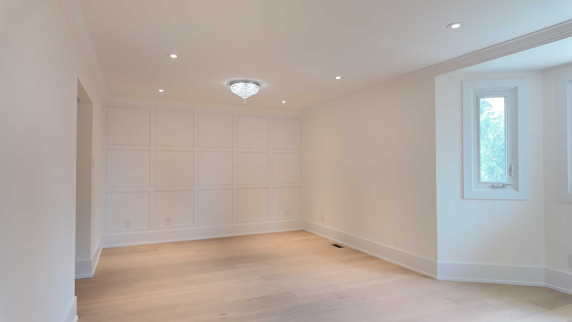Waffle ceiling matching the square trim wall, brick accent TV