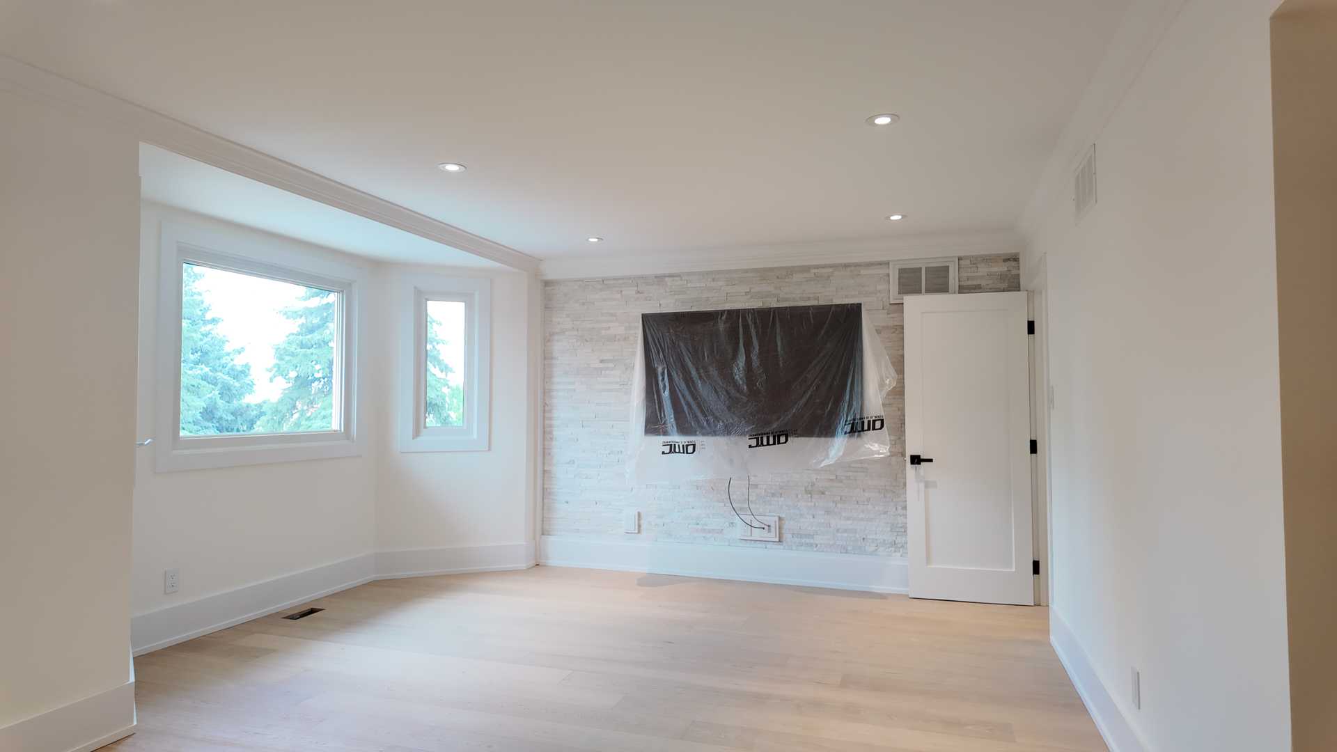 Waffle ceiling matching the square trim wall, brick accent TV