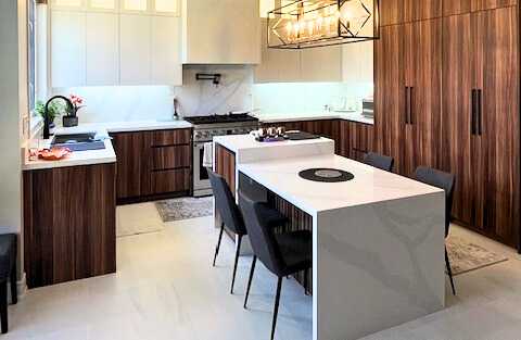 Dark wood linear grain U shape kitchen with multilevel sintered