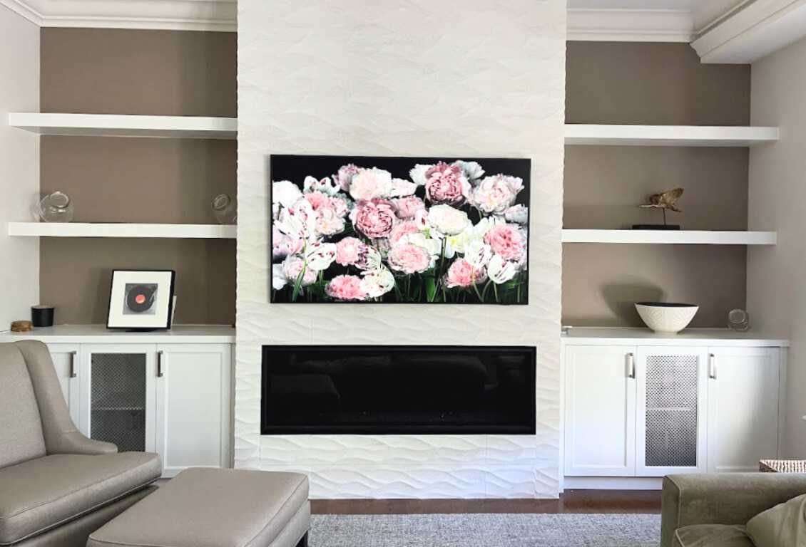 Complete home renovation with a statement wavy-textured fireplace wall. Kitchen