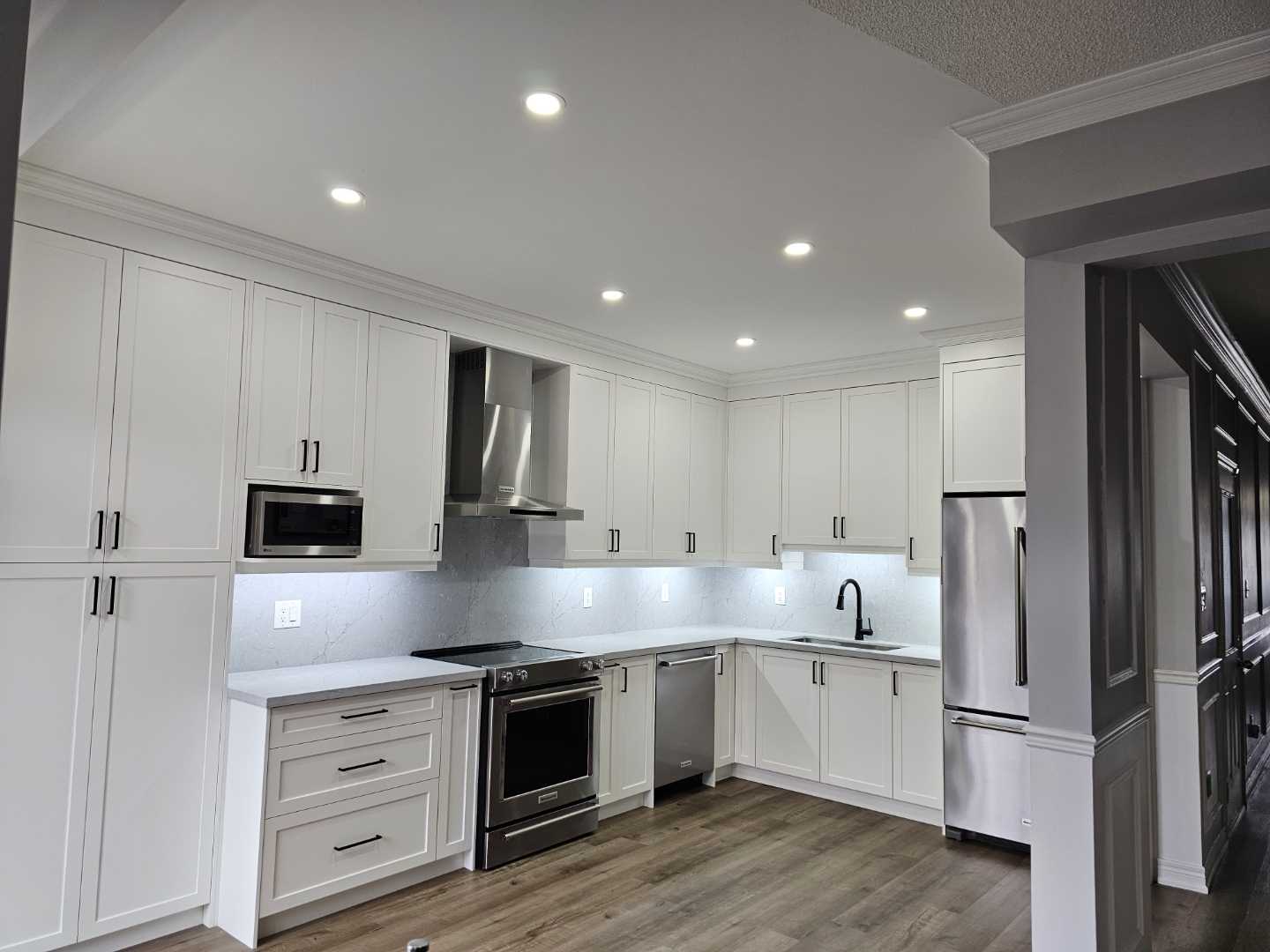 White shaker Built-in customize kitchen cabinets with drawers with brownish
