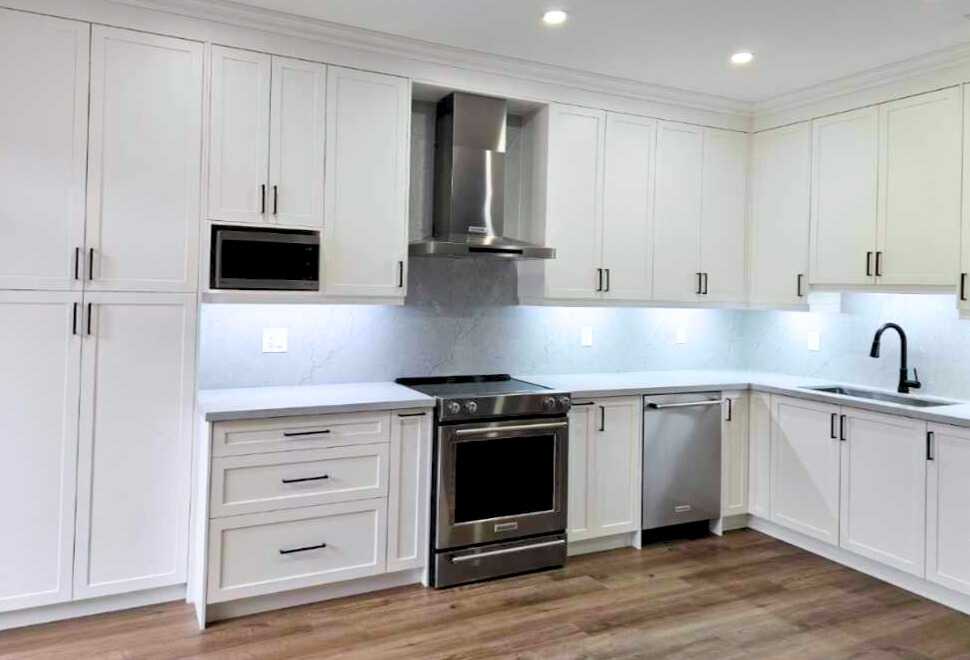 White shaker Built-in customize kitchen cabinets with drawers with brownish
